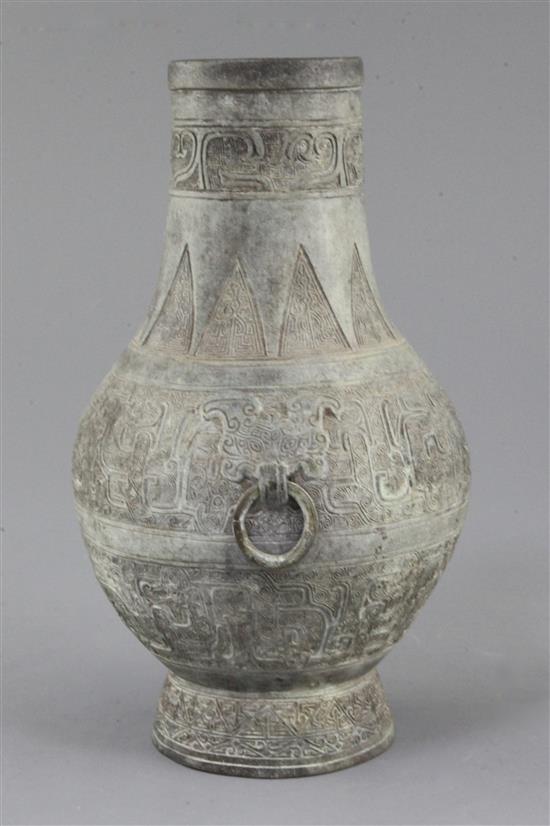 A Chinese archaic bronze ritual wine vessel, Hu, Eastern Zhou dynasty, 5th-3rd century B.C., 24cm high, small hole